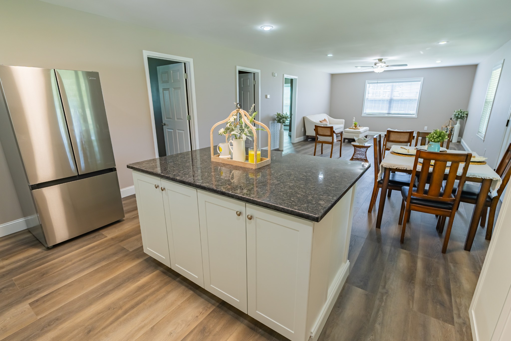 34 Bailey Road Decherd, TN 37324 - Photo 15 of 27 a kitchen with stainless steel appliances granite countertop furniture wooden floor and a refrigerator