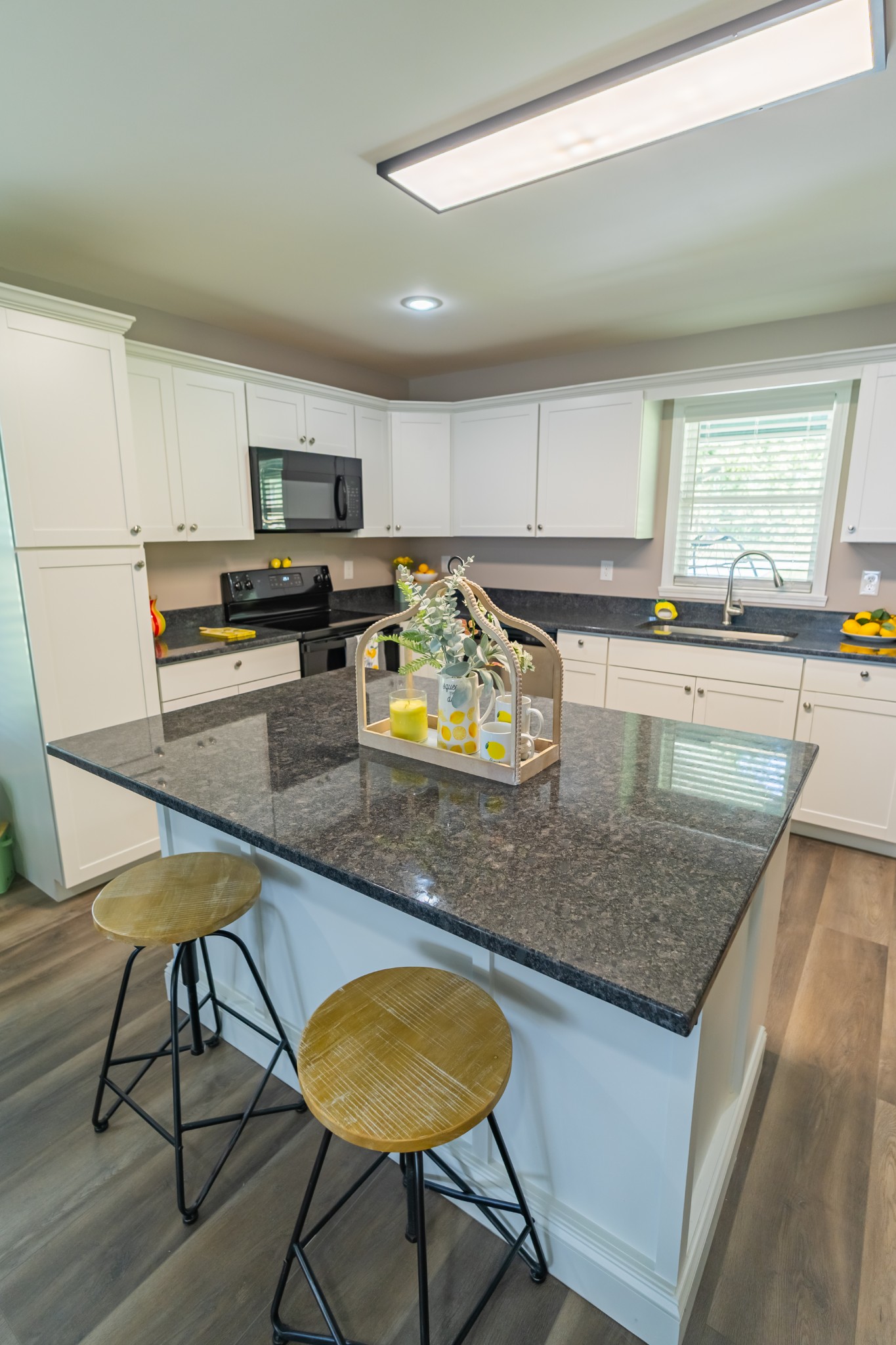 34 Bailey Road Decherd, TN 37324 - Photo 19 of 27 a kitchen with stainless steel appliances granite countertop a sink counter space and cabinets