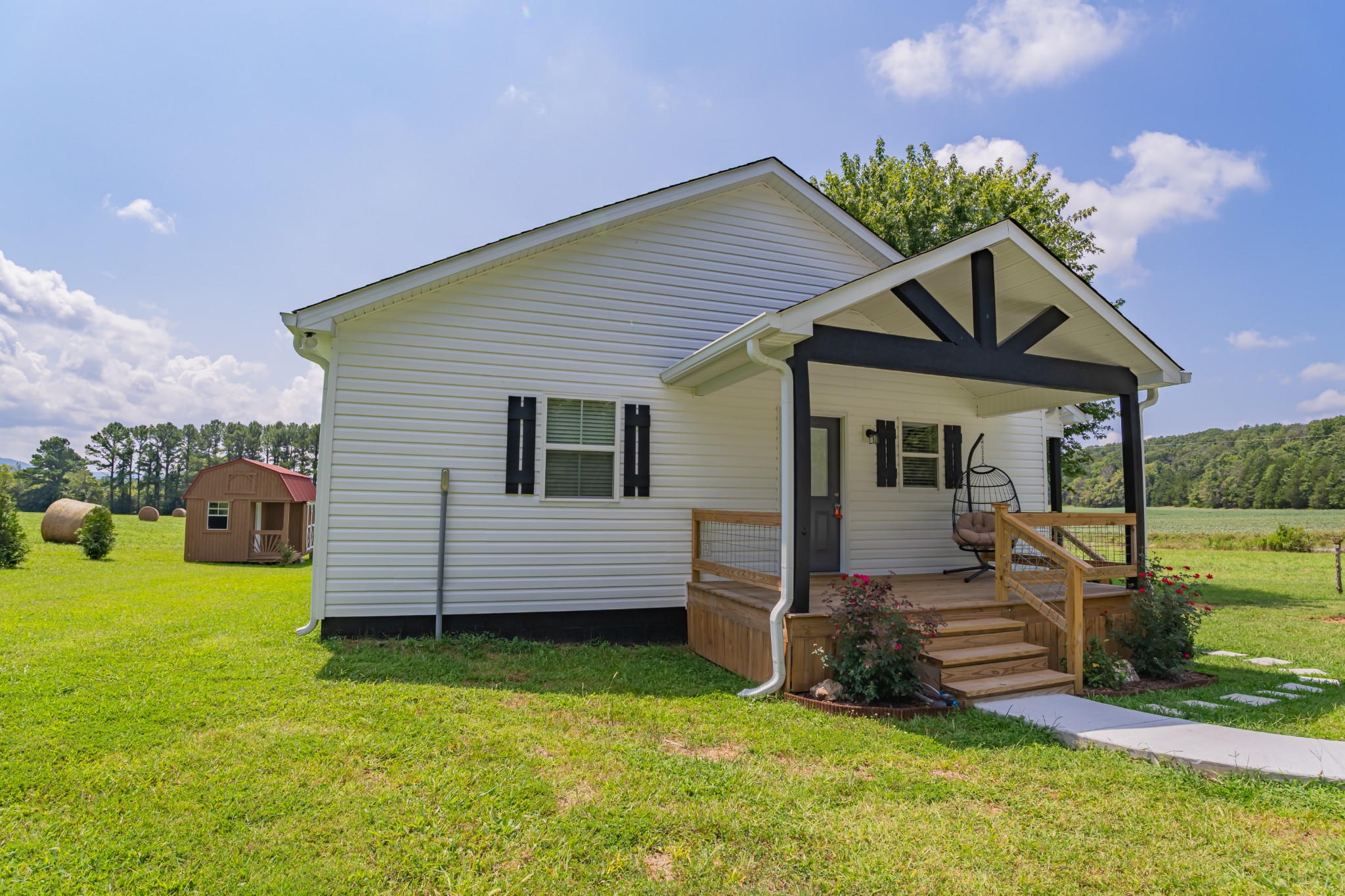 34 Bailey Road Decherd, TN 37324 - Photo 2 of 27 a front view of a house with a garden