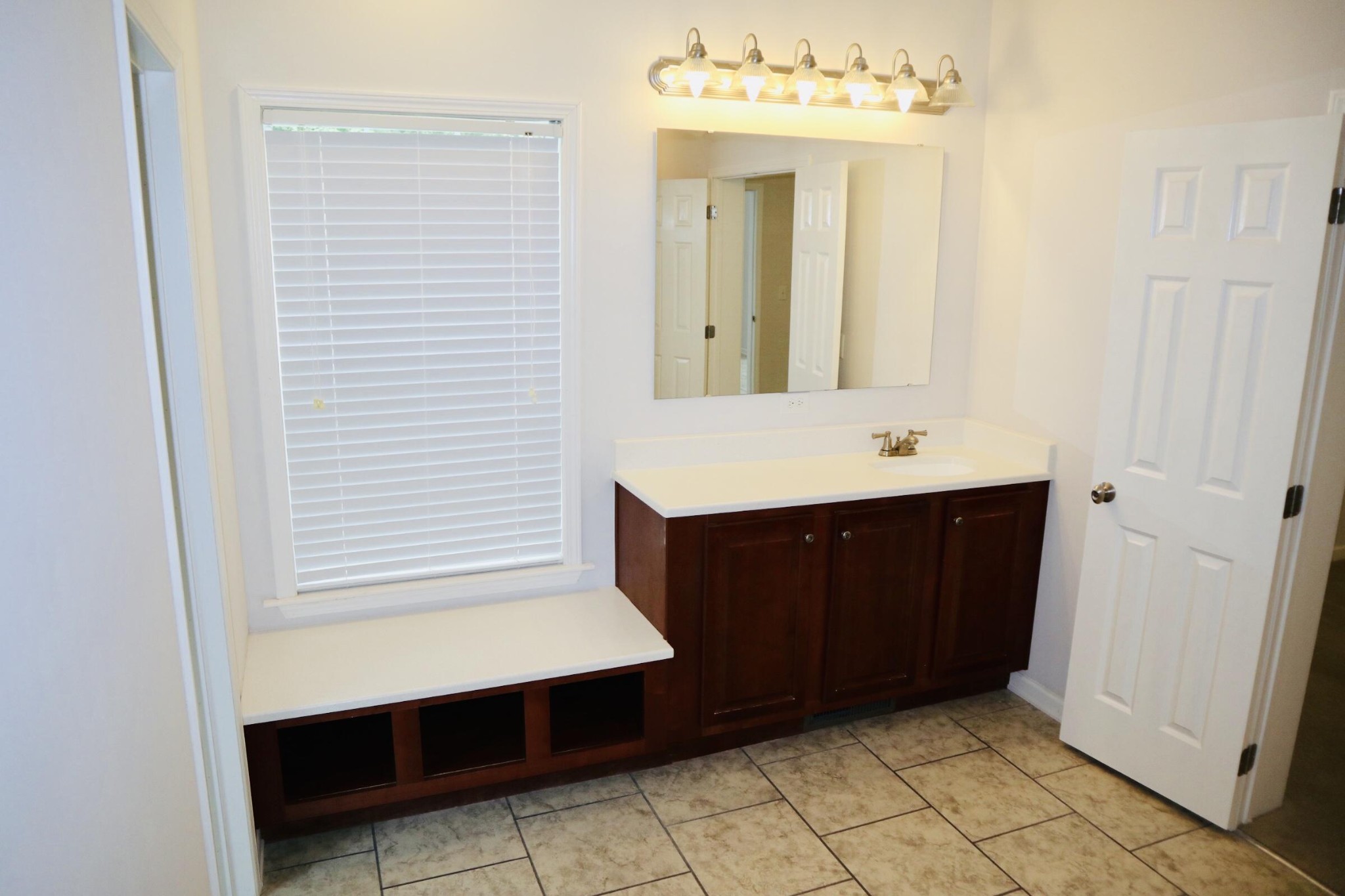 834 East Raccoon Valley Drive Heiskell, TN 37754 - Photo 12 of 20 a bathroom with a sink vanity and mirror