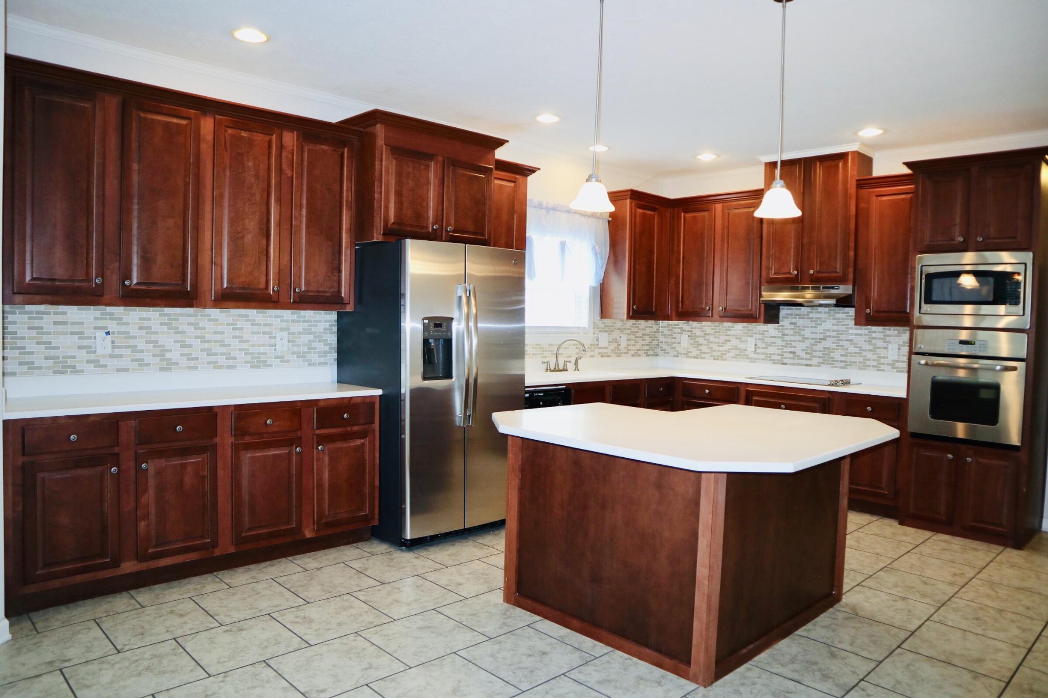 834 East Raccoon Valley Drive Heiskell, TN 37754 - Photo 4 of 20 a kitchen with stainless steel appliances granite countertop a sink a stove and a refrigerator