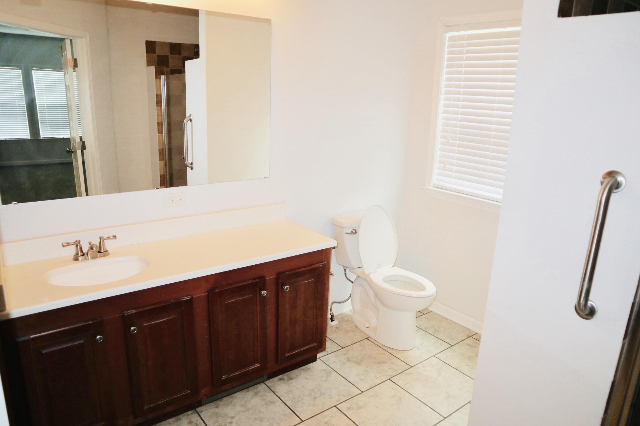 834 East Raccoon Valley Drive Heiskell, TN 37754 - Photo 9 of 20 a bathroom with a sink a toilet and a mirror