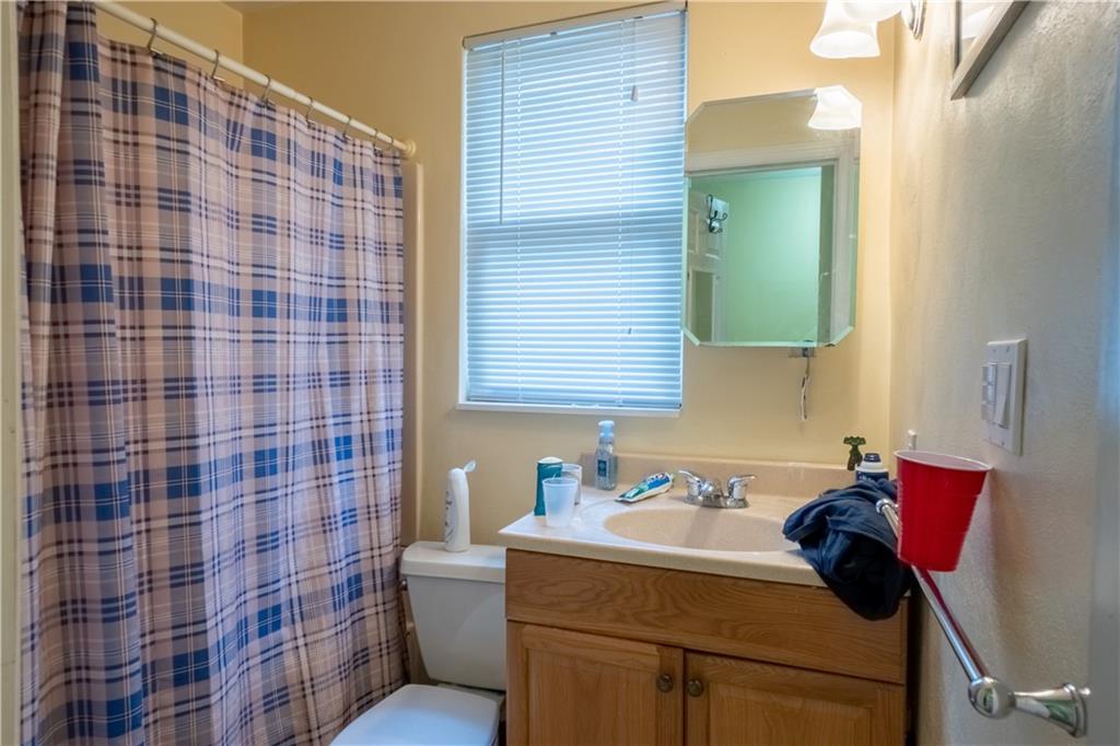 5407 Verona Road Verona, PA 15147 - Photo 11 of 25 a bathroom with a sink toilet and shower