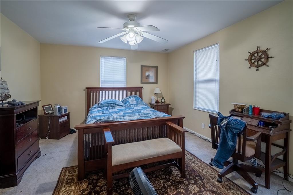 5407 Verona Road Verona, PA 15147 - Photo 12 of 25 a bedroom with a bed and a table in it