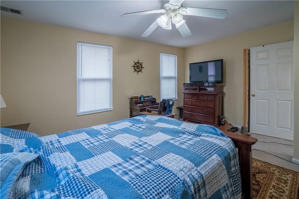 5407 Verona Road Verona, PA 15147 - Photo 13 of 25 a bedroom with a bed and a flat tv screen on dresser