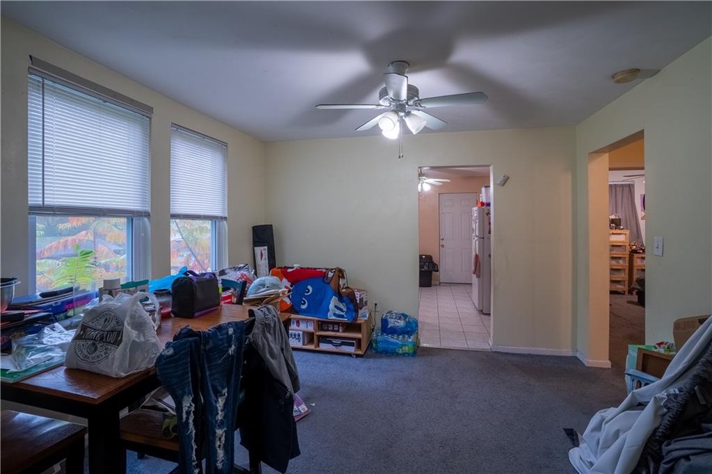 5407 Verona Road Verona, PA 15147 - Photo 15 of 25 a living room with furniture a flat screen tv and a window