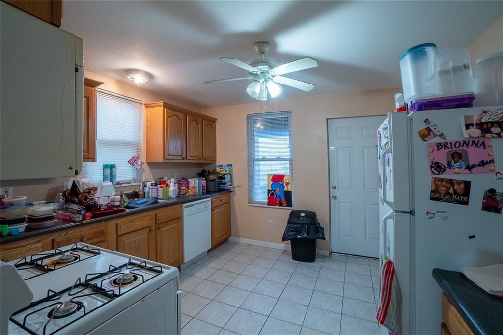 5407 Verona Road Verona, PA 15147 - Photo 17 of 25 a kitchen with refrigerator and cabinets