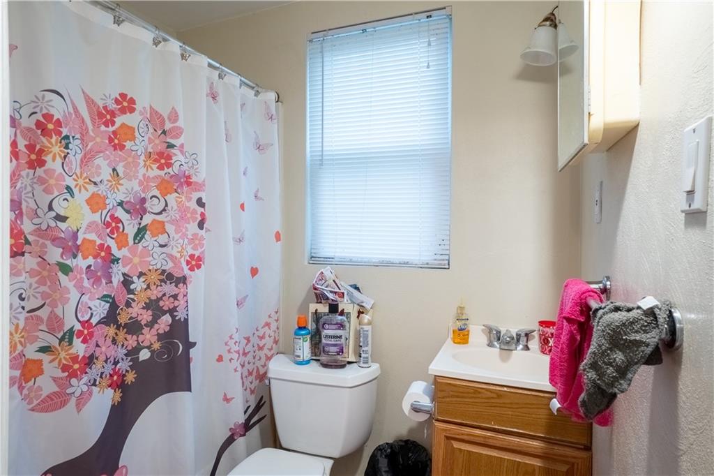 5407 Verona Road Verona, PA 15147 - Photo 19 of 25 a bathroom with a sink toilet and shower