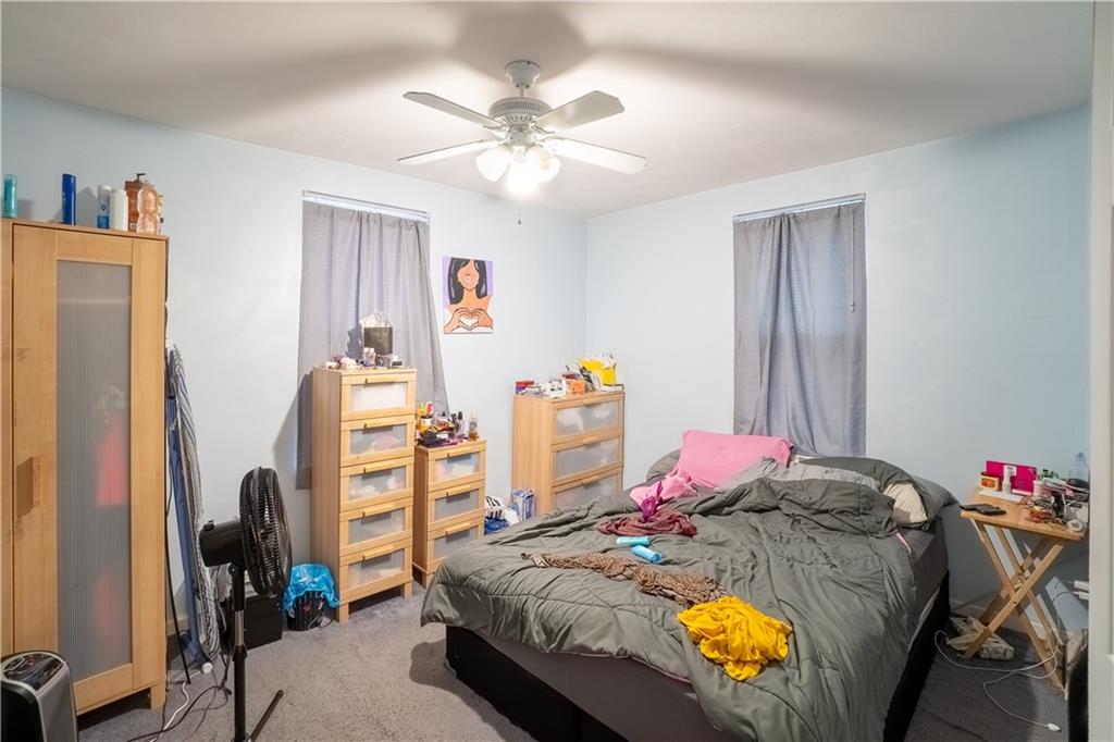 5407 Verona Road Verona, PA 15147 - Photo 20 of 25 a bed sitting in a bedroom next to a window