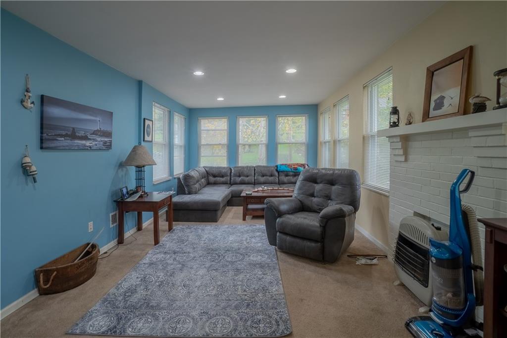 5407 Verona Road Verona, PA 15147 - Photo 3 of 25 a living room with furniture a flat screen tv and a window