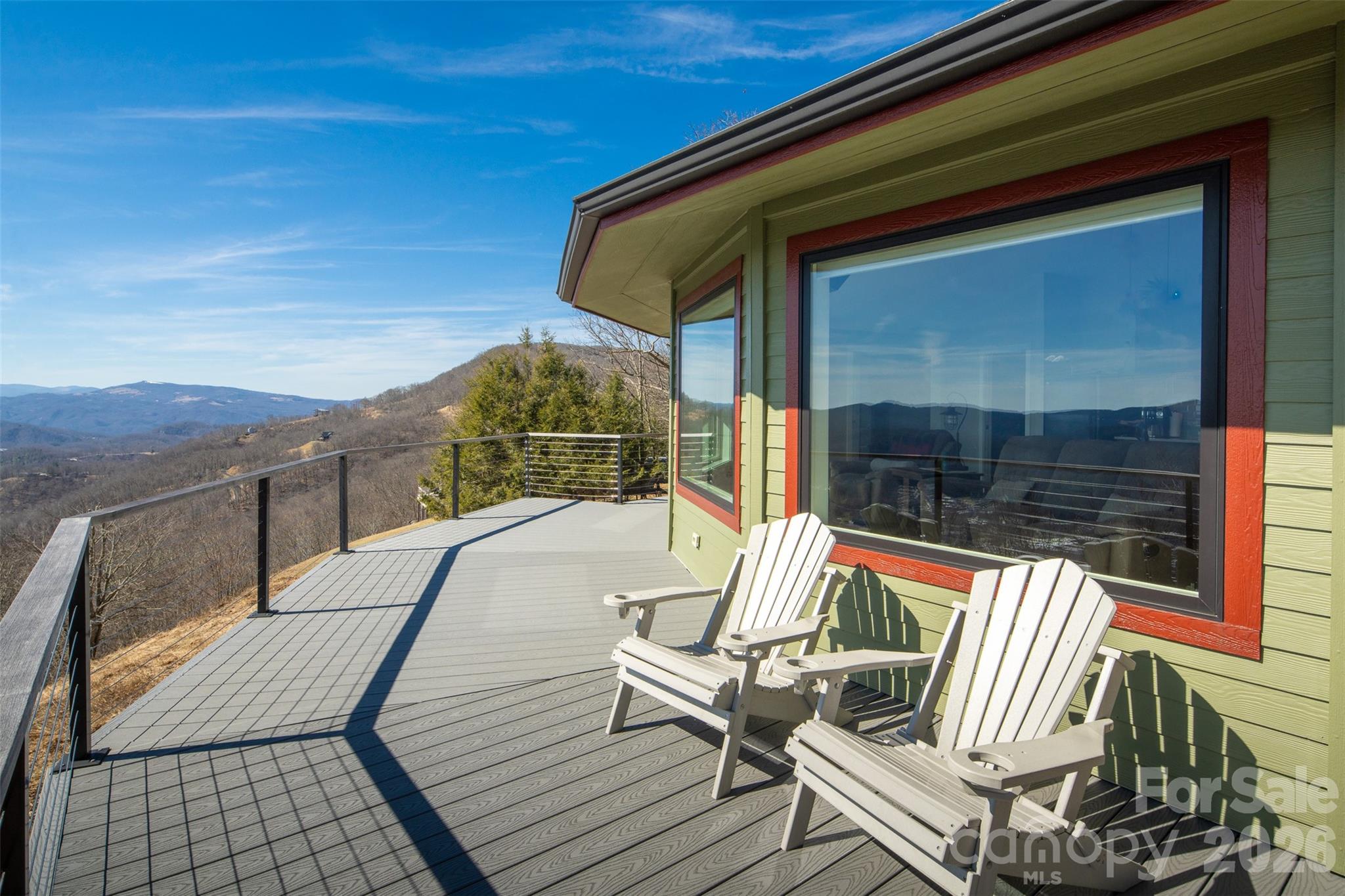 448 Howards Knob Road Boone, NC 28607 - Photo 18 of 38 a view of sitting area with furniture and wooden deck