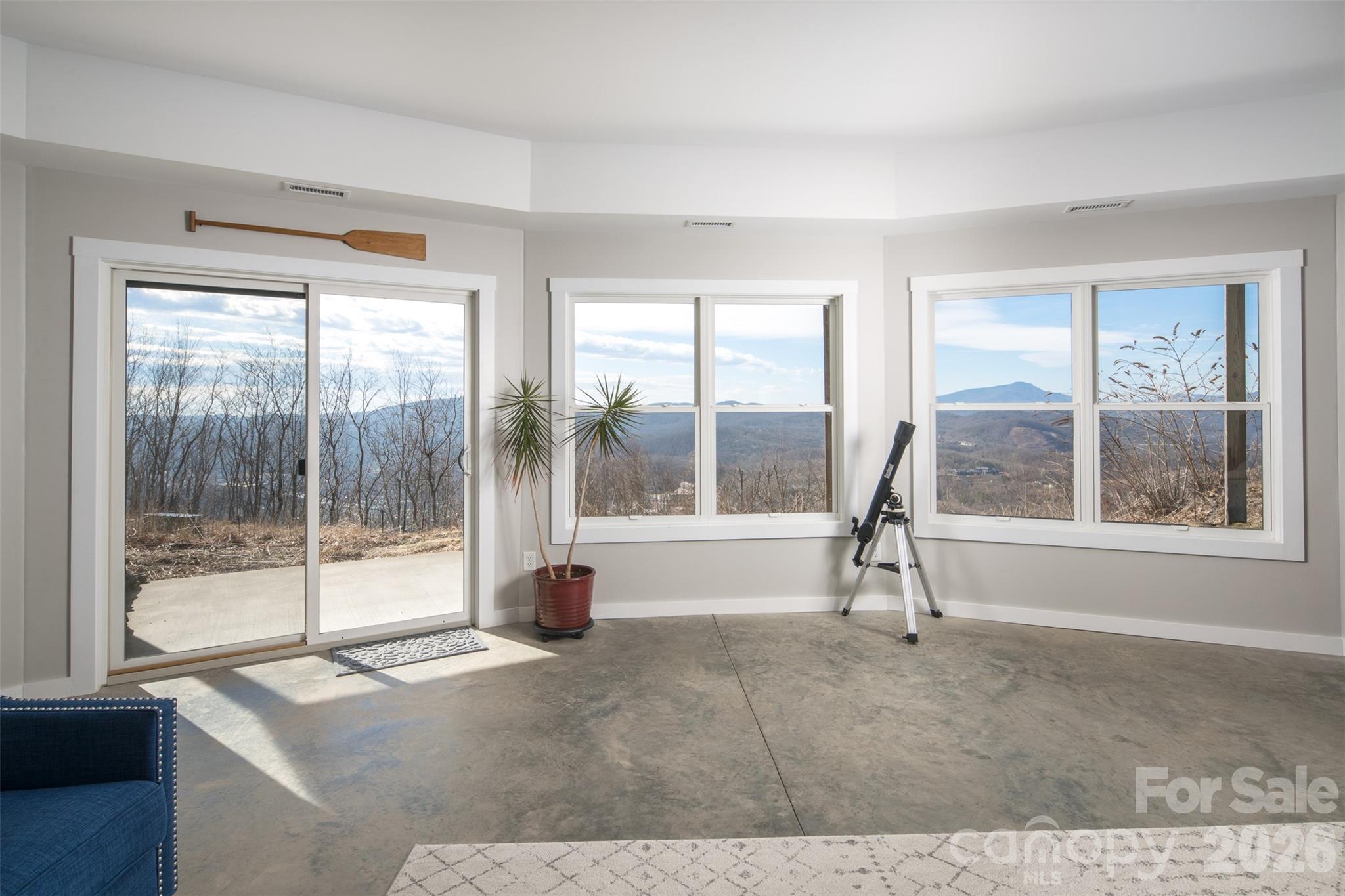 448 Howards Knob Road Boone, NC 28607 - Photo 20 of 38 a living room with a large window