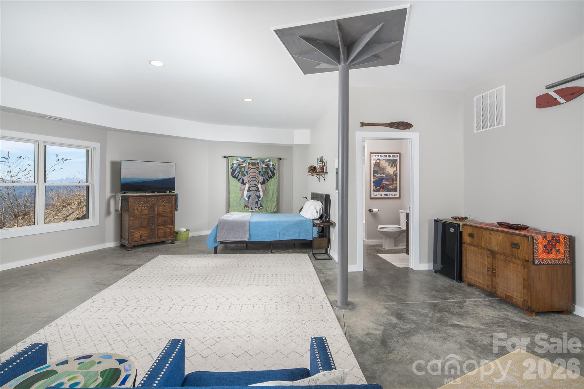 448 Howards Knob Road Boone, NC 28607 - Photo 21 of 38 a living room with furniture and a flat screen tv