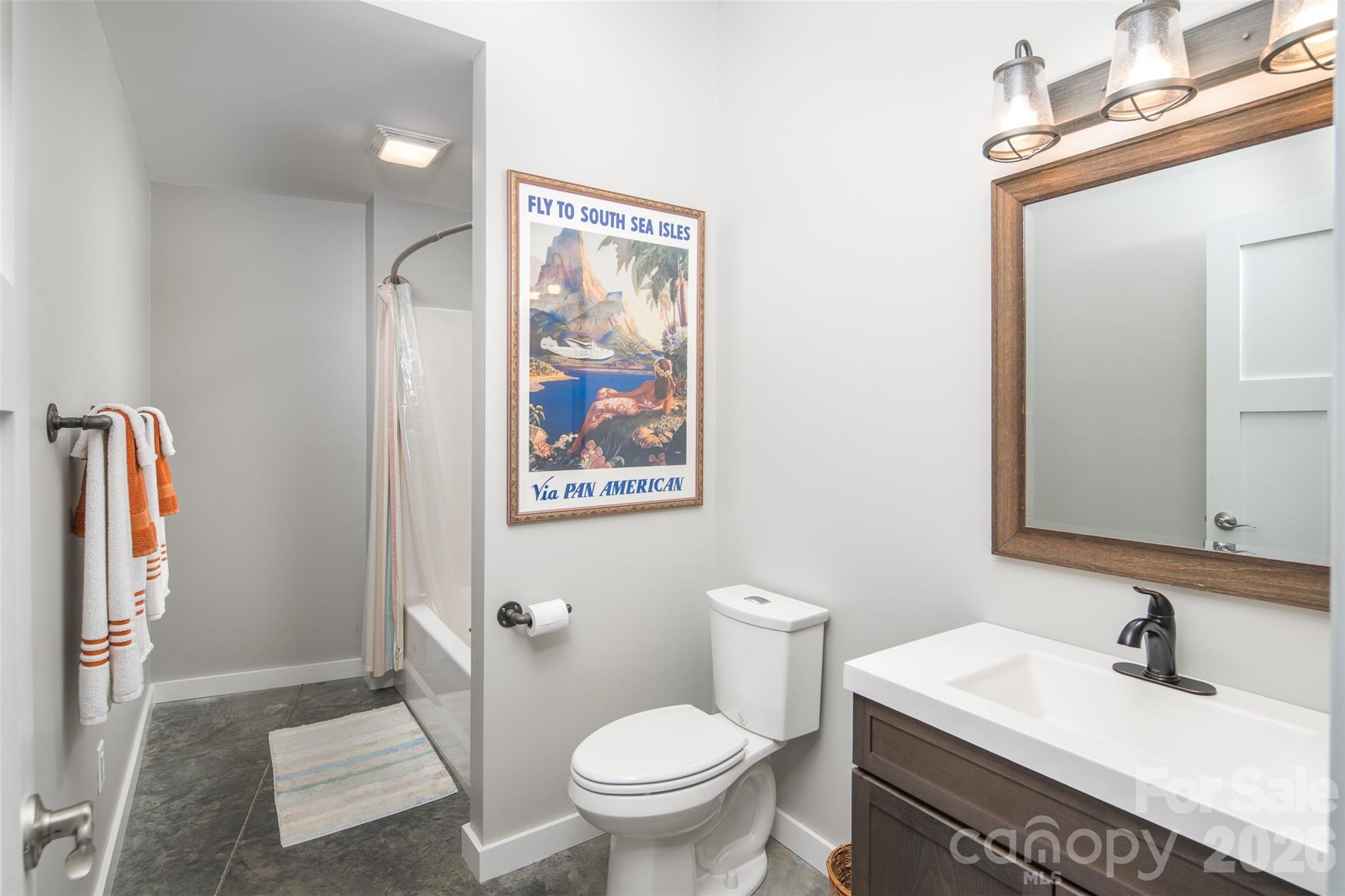 448 Howards Knob Road Boone, NC 28607 - Photo 22 of 38 a bathroom with a sink toilet and shower