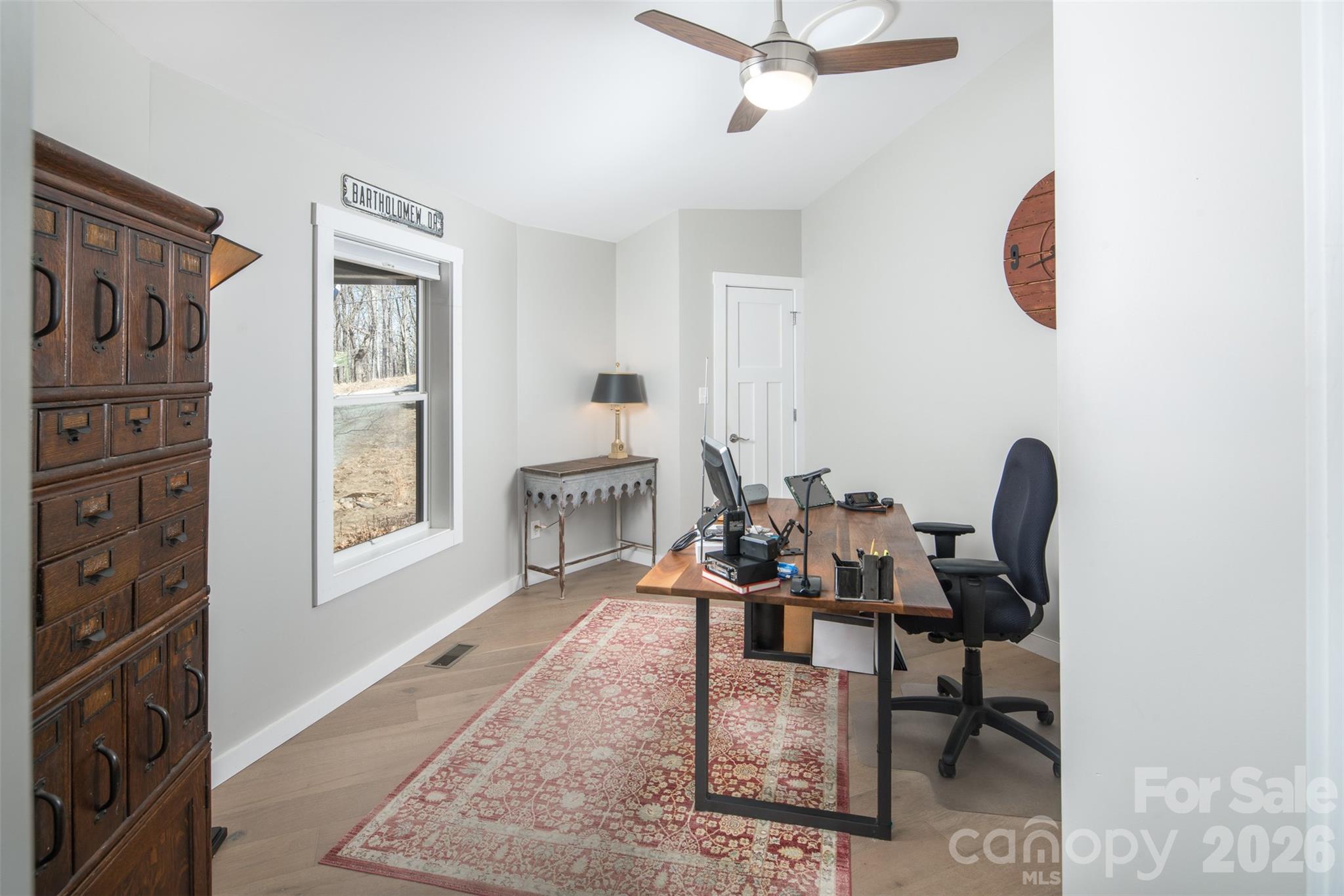 448 Howards Knob Road Boone, NC 28607 - Photo 26 of 38 a living room with furniture a rug and a window