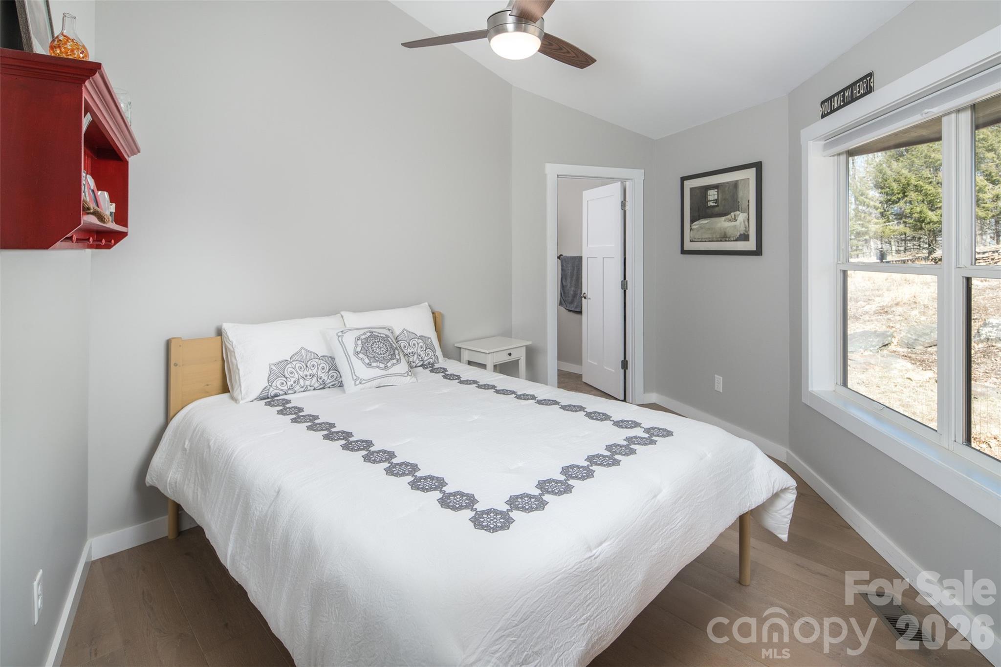 448 Howards Knob Road Boone, NC 28607 - Photo 30 of 38 a bedroom with a bed and a window