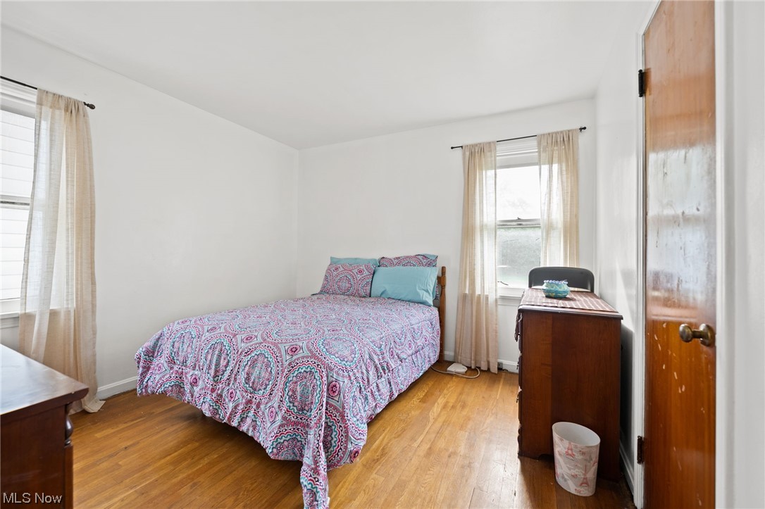 4170 Stilmore Road Cleveland, OH 44121 - Photo 22 of 26 Bedroom featuring light hardwood floors