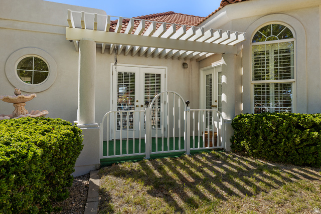 389 North Main Street St. George, UT 84770 - Photo 9 of 44 View of exterior entry with french doors, stucco siding, a tile roof, and a patio
