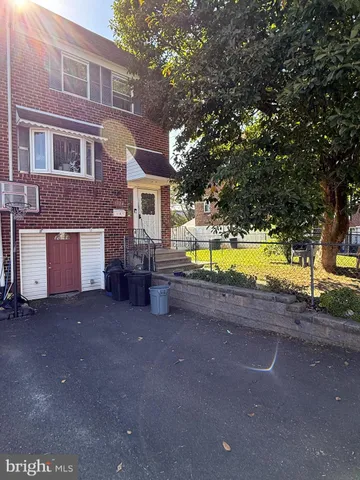 a view of a house with swimming pool and sitting area