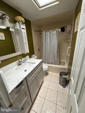 a kitchen with stainless steel appliances a refrigerator sink and cabinets