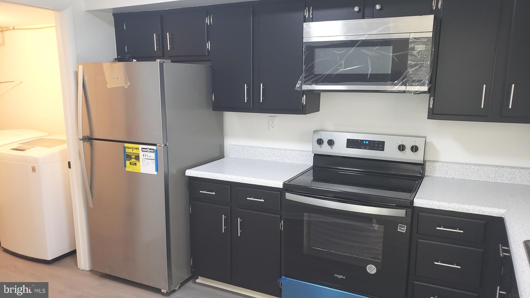 1906 Chelmsford Circle Newark, DE 19713 - Photo 5 of 14 a white refrigerator freezer sitting inside of a kitchen