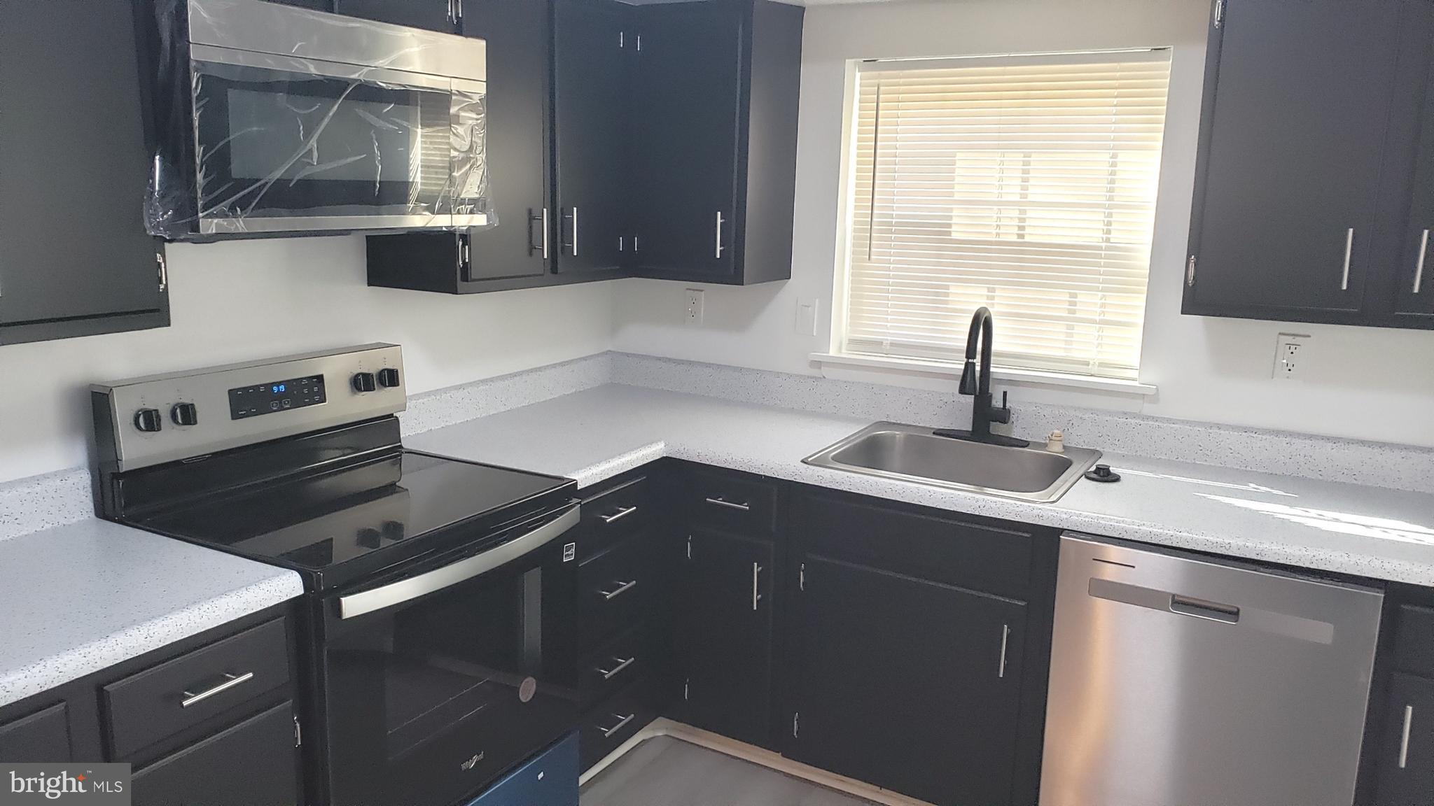 1906 Chelmsford Circle Newark, DE 19713 - Photo 6 of 14 a kitchen with a sink and a window