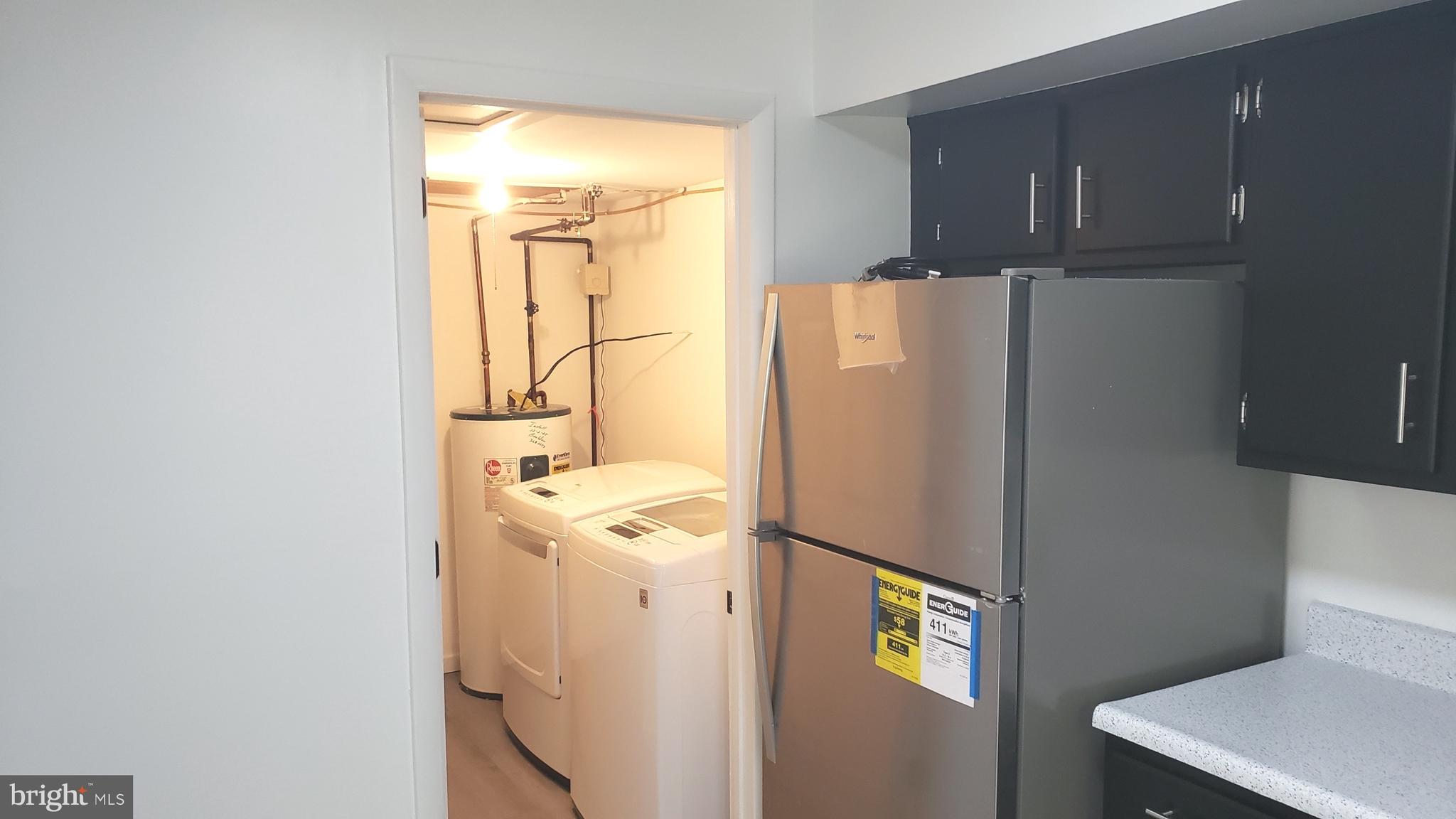 1906 Chelmsford Circle Newark, DE 19713 - Photo 7 of 14 a white refrigerator freezer sitting inside of a kitchen