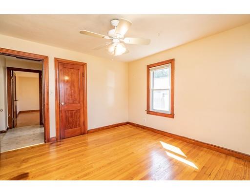 135 Victoria Street Springfield, MA 01104 - Photo 8 of 18 a view of an empty room with wooden floor