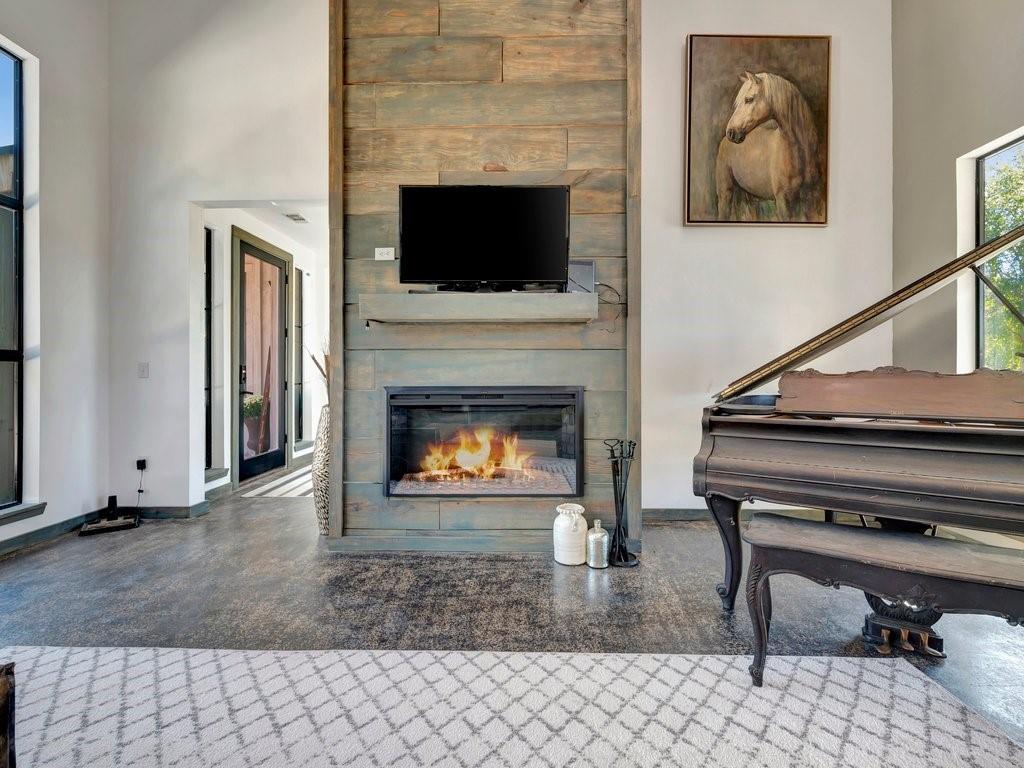 a living room with a fireplace and a fireplace