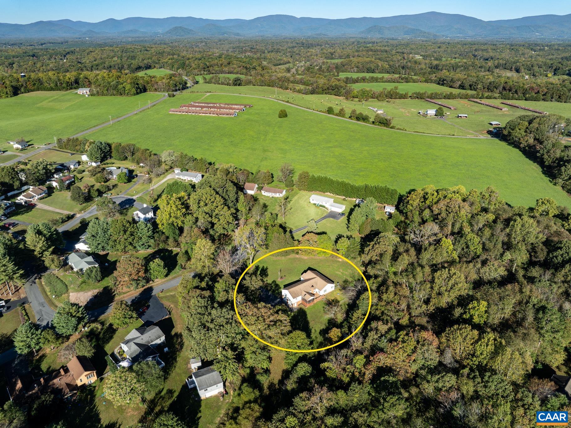 208 Rolling Hills Road Ruckersville, VA 22968 - Photo 50 of 56 a view of a town with mountains in the background