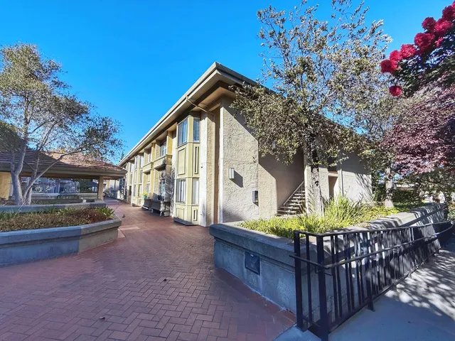 a front view of house with yard and outdoor seating