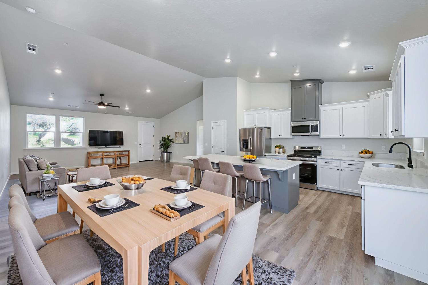 41940 Colt Court Coarsegold, CA 93614 - Photo 14 of 50 a large kitchen with a table and chairs in it