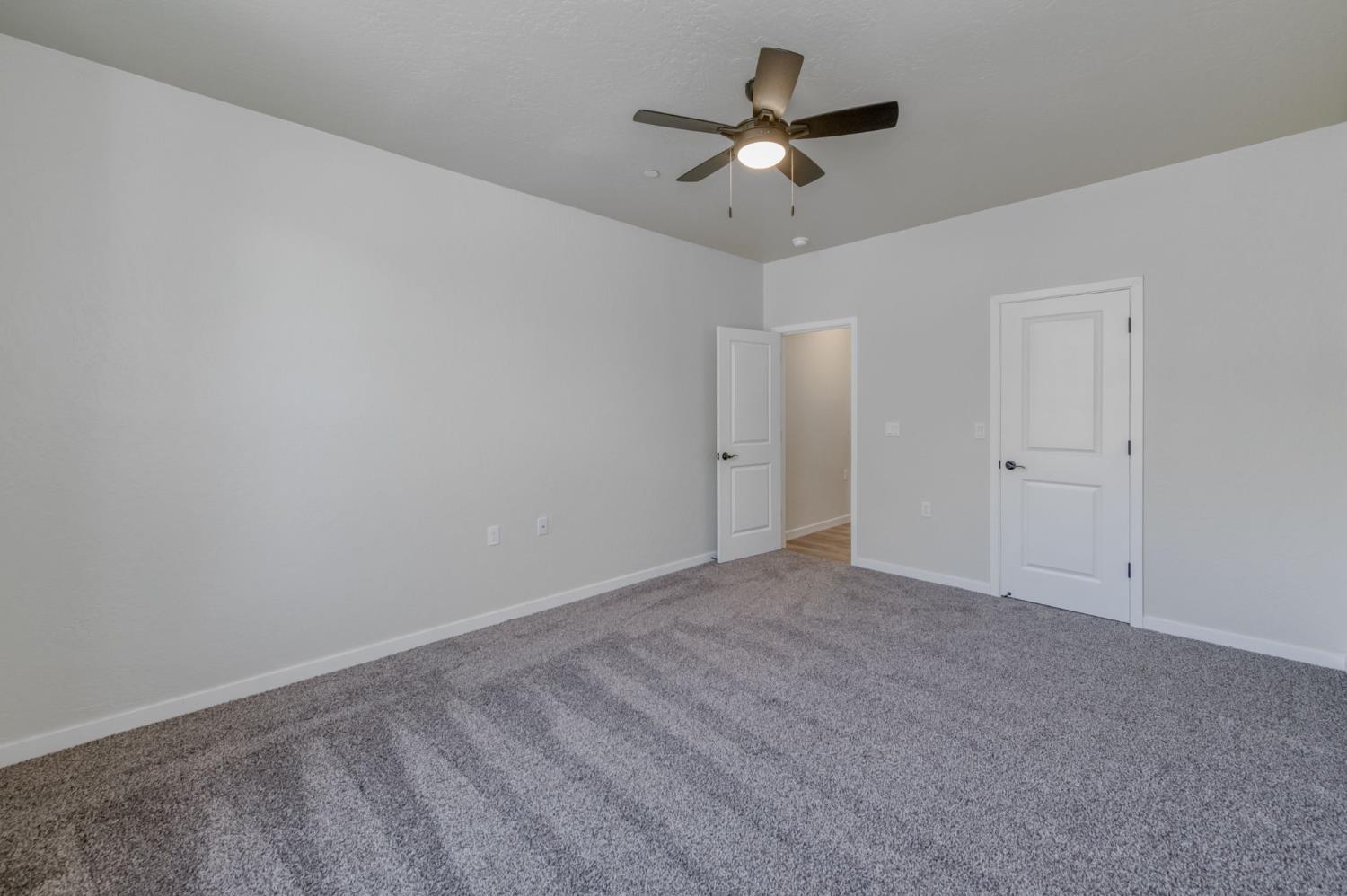 41940 Colt Court Coarsegold, CA 93614 - Photo 23 of 50 an empty room with a view of a ceiling fan