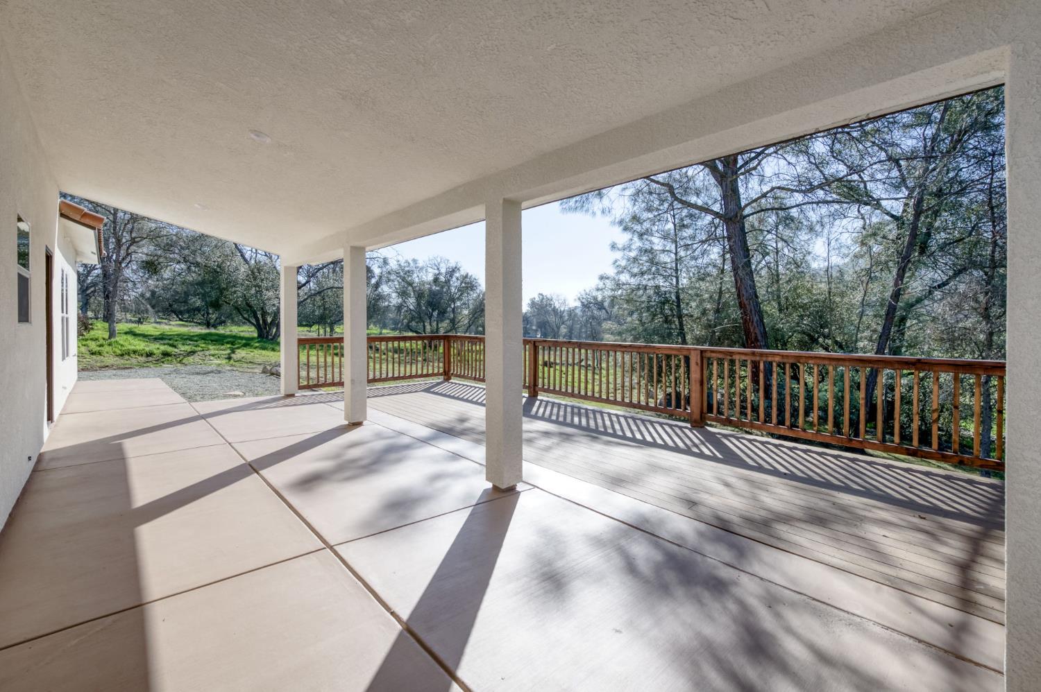 41940 Colt Court Coarsegold, CA 93614 - Photo 36 of 50 a view of a room with wooden floor and windows