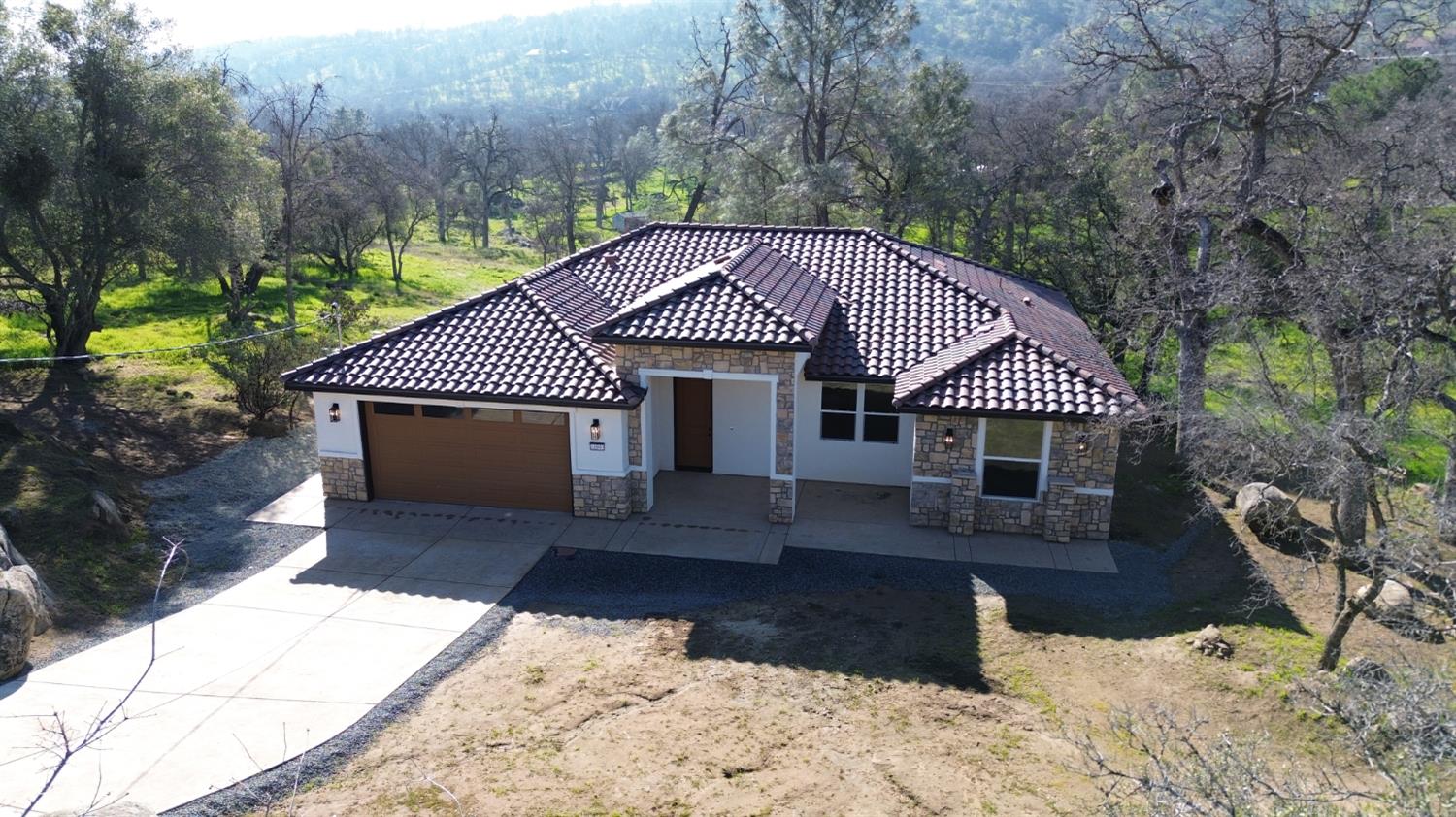 41940 Colt Court Coarsegold, CA 93614 - Photo 50 of 50 a front view of a house with a yard