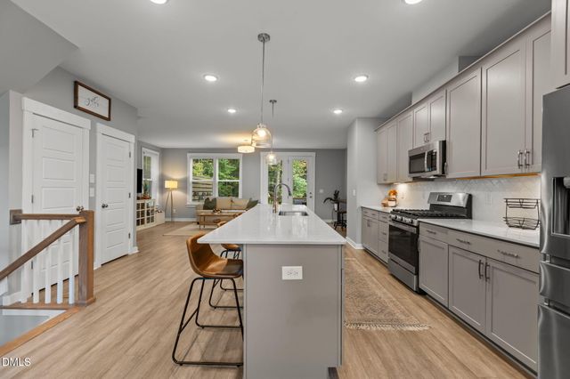 a bedroom with furniture and large windows