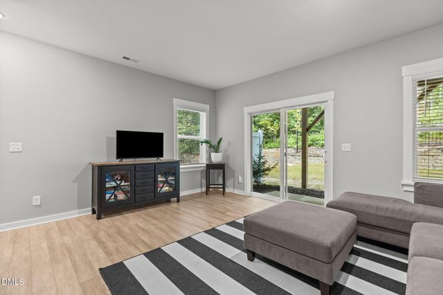 a bathroom with a sink mirror and toilet