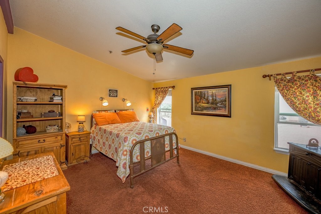 33330 Palen Road Agua Dulce, CA 91390 - Photo 14 of 56 a bedroom with a bed and a flat tv screen on the dresser