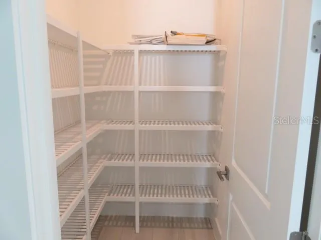 a view of a room with racks on the wall