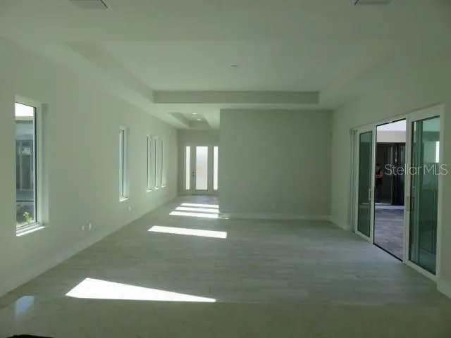 a view of empty room with floor to ceiling window
