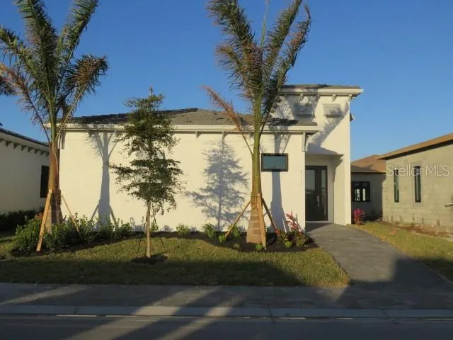 a view of a house with a yard