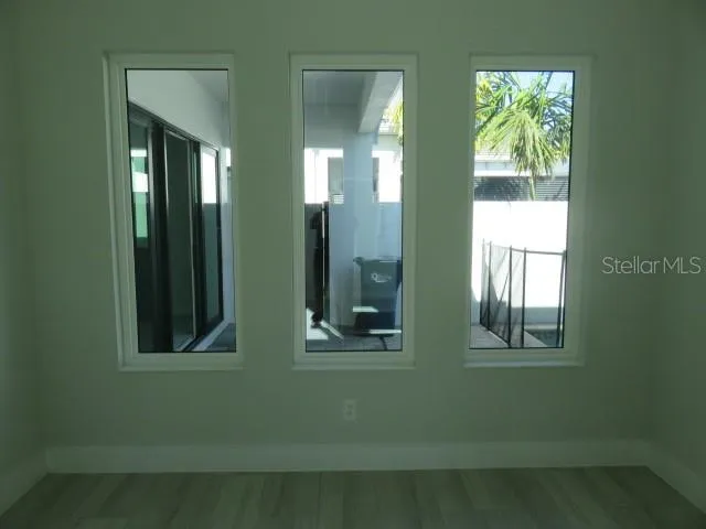 a view of a room that has two windows