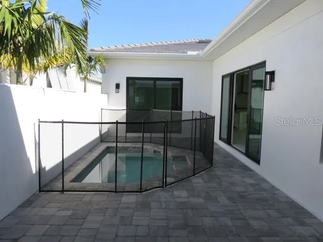 a view of entryway with a floor to ceiling window and potted plants