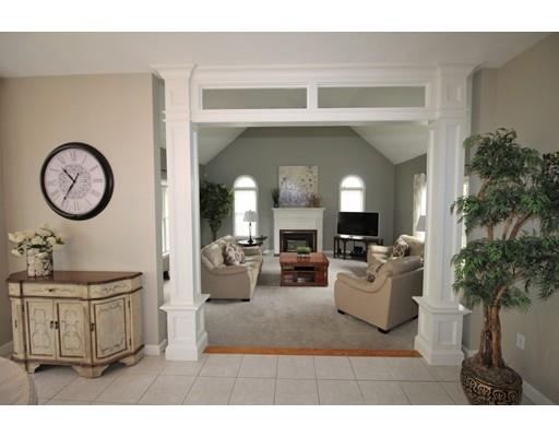 6 Wagon Wheel Road North Attleboro, MA 02760 - Photo 11 of 30 a living room with furniture a clock and a potted plant