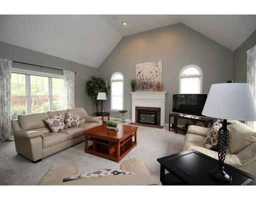6 Wagon Wheel Road North Attleboro, MA 02760 - Photo 12 of 30 a living room with furniture a fireplace and a large window