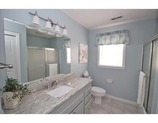 6 Wagon Wheel Road North Attleboro, MA 02760 - Photo 18 of 30 a bathroom with a sink a toilet a mirror and a window
