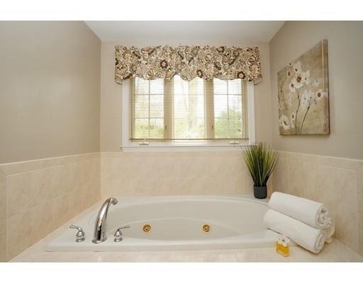 6 Wagon Wheel Road North Attleboro, MA 02760 - Photo 22 of 30 a bathroom with a bathtub a window and a shower curtain