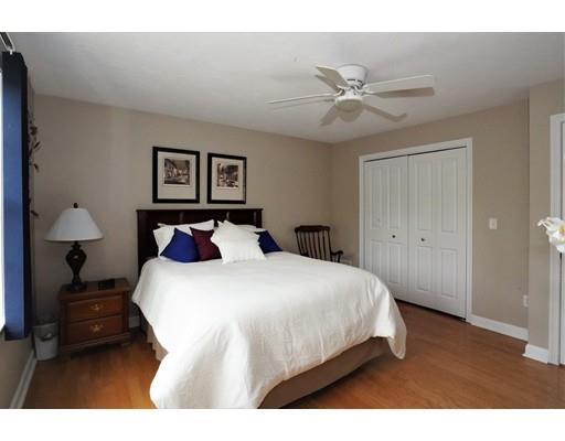 6 Wagon Wheel Road North Attleboro, MA 02760 - Photo 26 of 30 a bedroom with a bed and a painting on the wall