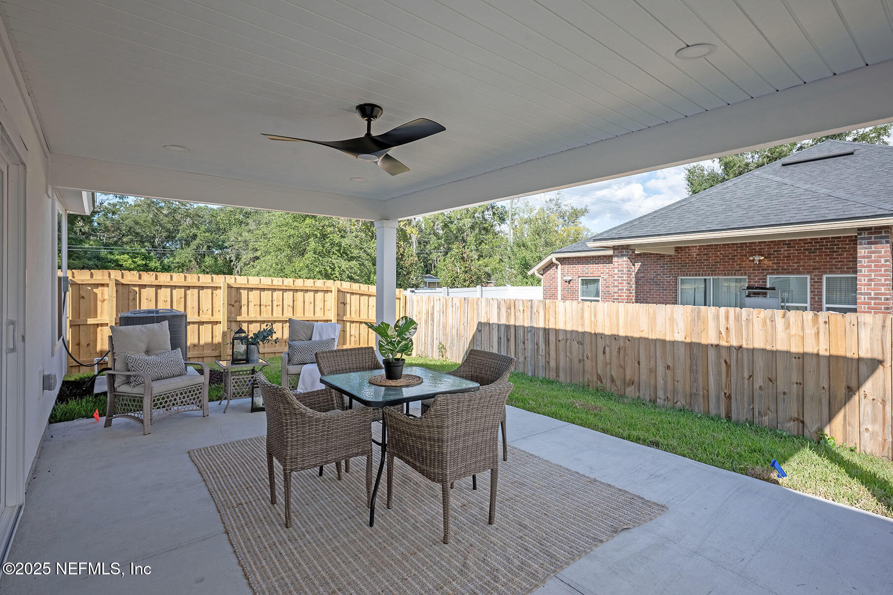 1235 Jewelstone Lane Jacksonville, FL 32221 - Photo 21 of 32 a view of a patio with a table chairs and backyard