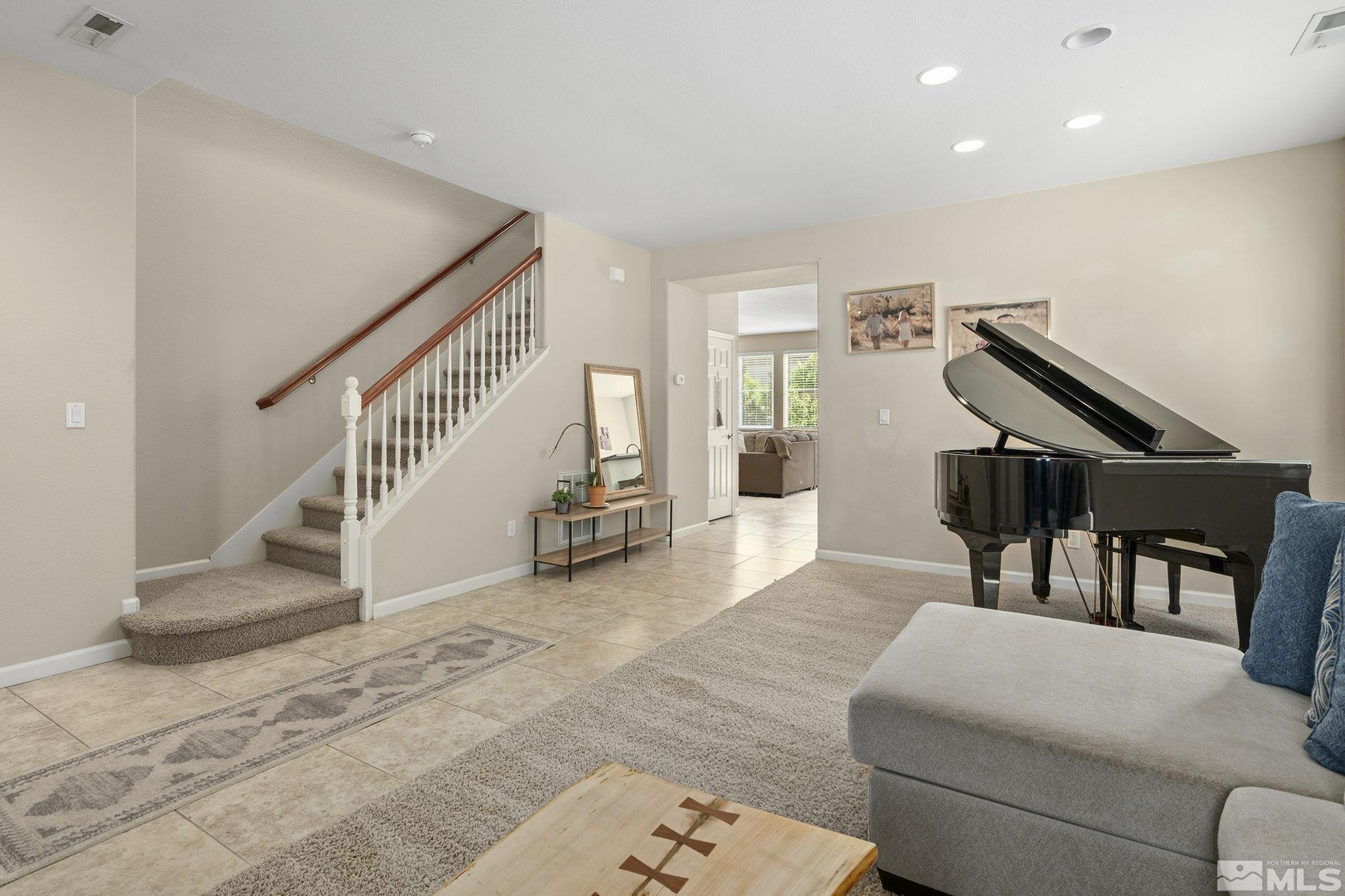 10854 Oakhaven Drive Reno, NV 89521 - Photo 3 of 38 a living room with furniture and stairs
